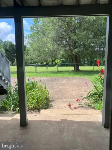 a view of swimming pool with a yard