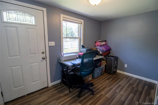 a view of balcony with wooden floor