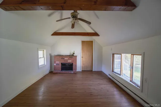 a kitchen with a sink cabinets and wooden floor