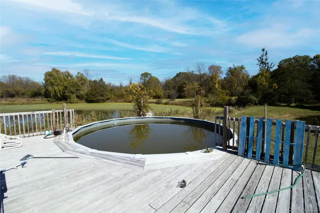 a view of deck with wooden floor and outdoor seating