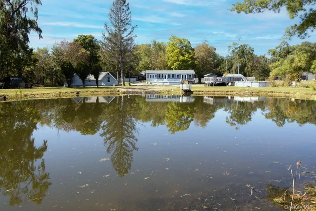 a view of a lake with a big yard