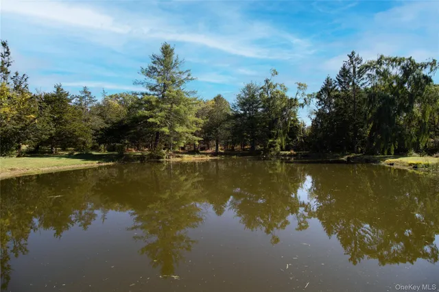 an aerial view of a house with yard swimming pool and outdoor seating