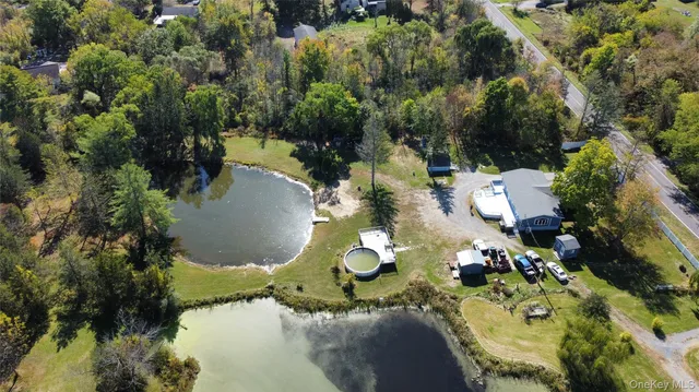 an aerial view of residential house with an outdoor space