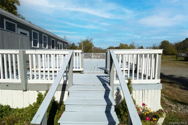a view of a house with wooden stairs