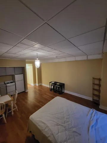 a bed room with a bed and a chair