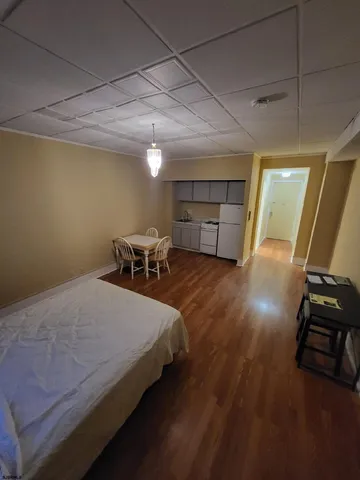 a bed room with a bed and a chair