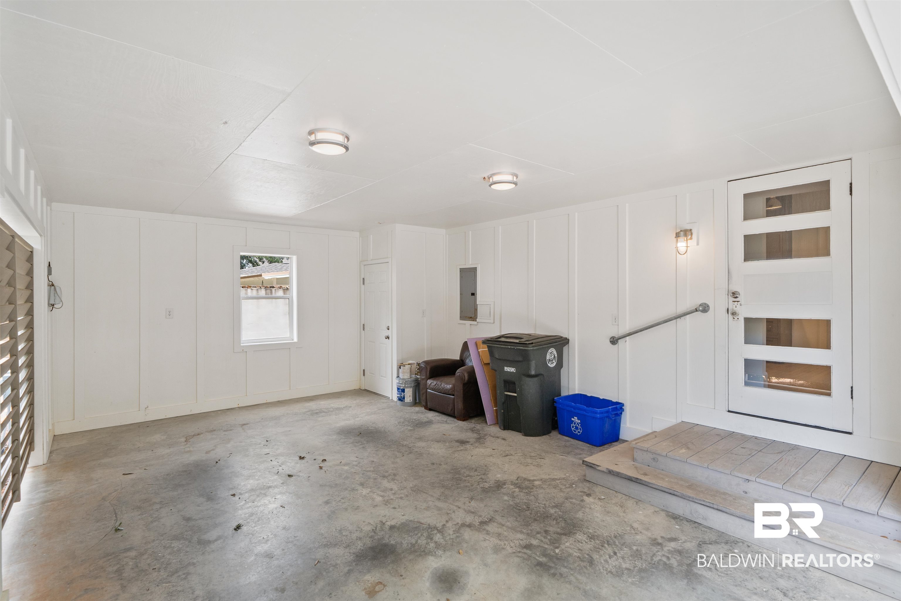 106 White Avenue Fairhope, AL 36532 - Photo 31 of 35 Garage featuring a decorative wall and electric panel