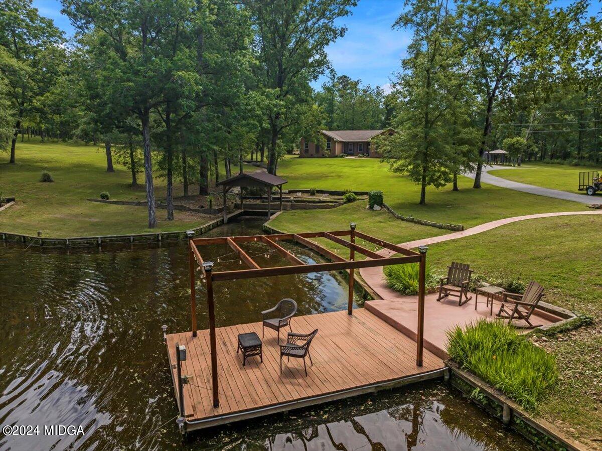 474 Plantation Road Gray, GA 31032 - Photo 1 of 64 a view of a swimming pool with a patio