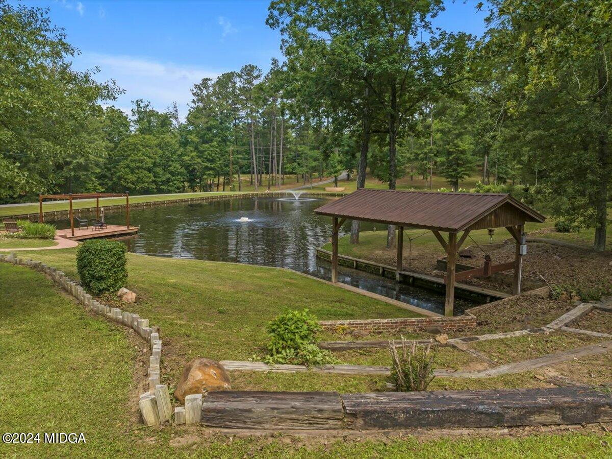 474 Plantation Road Gray, GA 31032 - Photo 14 of 64 a view of a swimming pool with a patio and a yard