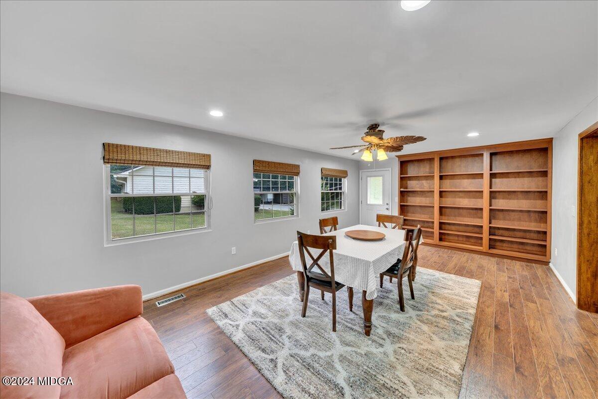 474 Plantation Road Gray, GA 31032 - Photo 25 of 64 a dining room with furniture and wooden floor