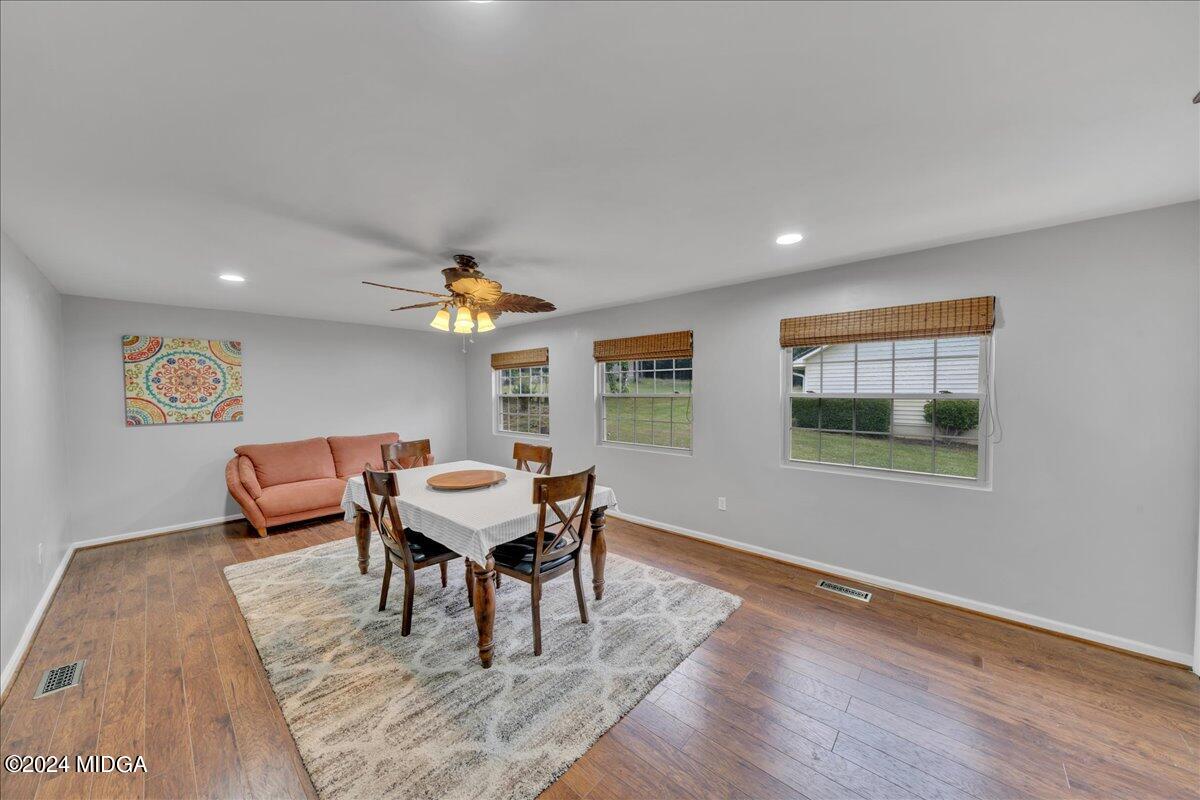 474 Plantation Road Gray, GA 31032 - Photo 26 of 64 a living room with furniture and a wooden floor