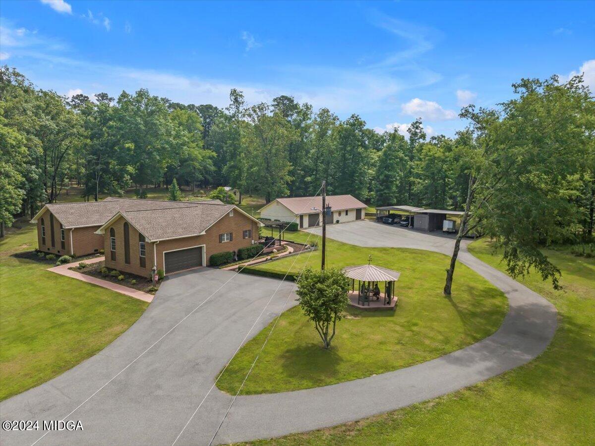 474 Plantation Road Gray, GA 31032 - Photo 49 of 64 an aerial view of a house with swimming pool and big yard