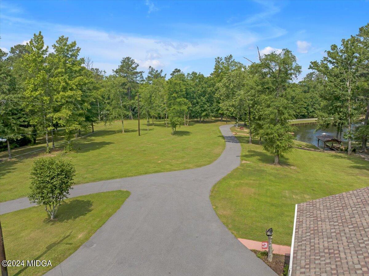 474 Plantation Road Gray, GA 31032 - Photo 51 of 64 a view of a swimming pool with a lake view