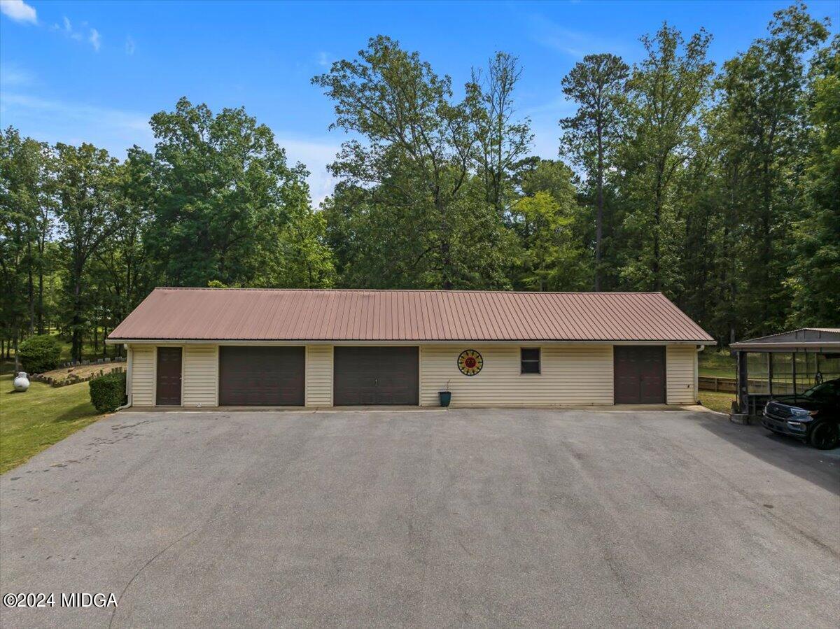 474 Plantation Road Gray, GA 31032 - Photo 53 of 64 a house that has a tree in front of it