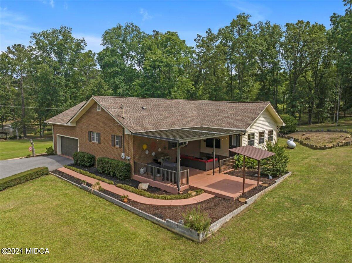 474 Plantation Road Gray, GA 31032 - Photo 56 of 64 aerial view of a house with swimming pool and porch