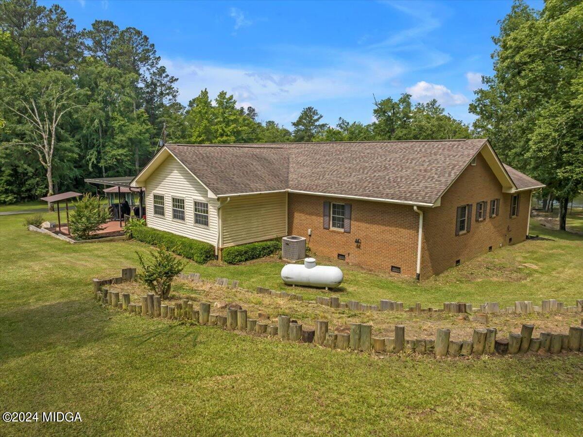 474 Plantation Road Gray, GA 31032 - Photo 59 of 64 a aerial view of a house with swimming pool and big yard