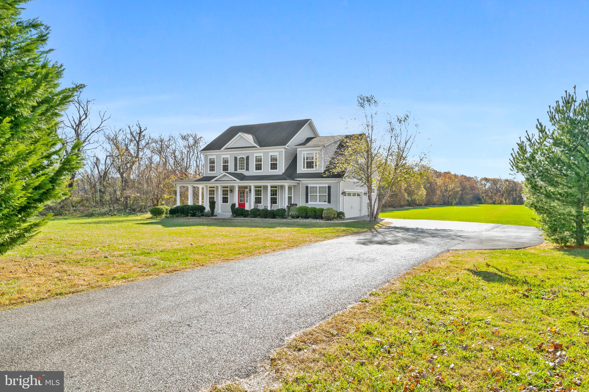 1965 Lowery Road Huntingtown, MD 20639 - Photo 1 of 54 a view of swimming pool with a big yard and large trees