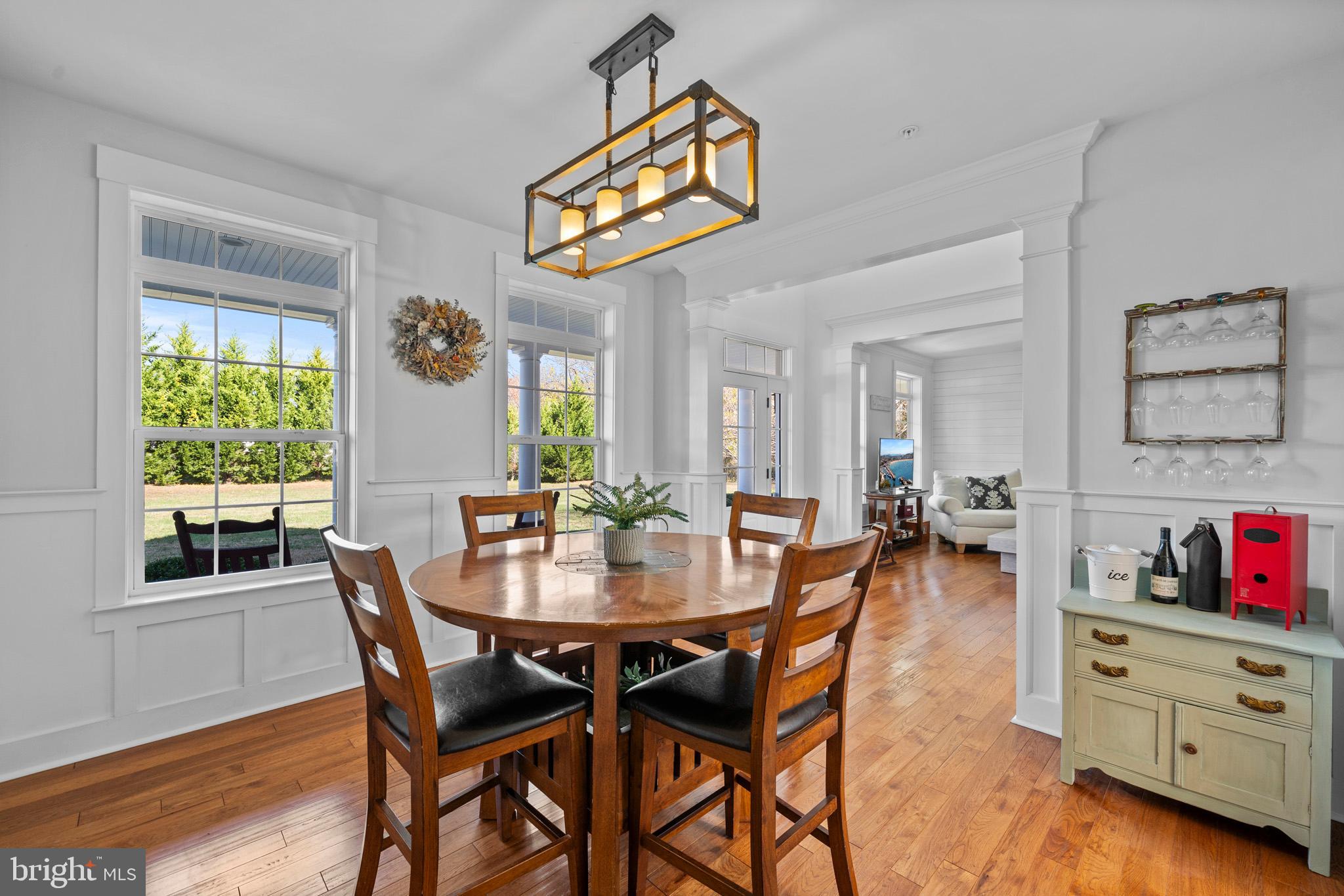 1965 Lowery Road Huntingtown, MD 20639 - Photo 12 of 54 a view of a dining room and kitchen with furniture window and wooden floor