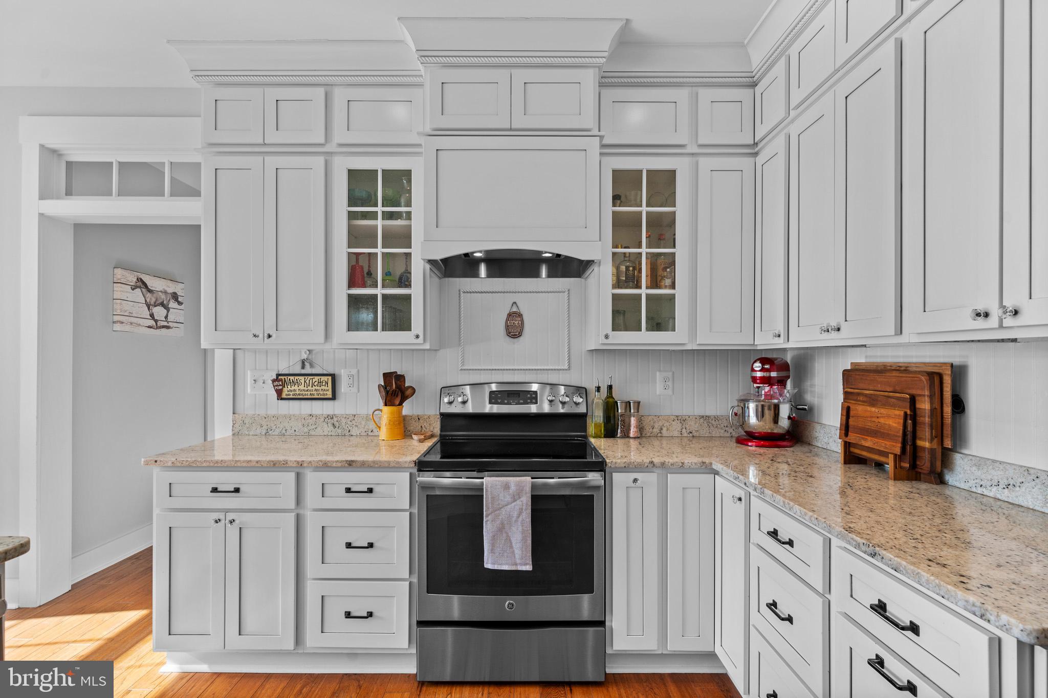 1965 Lowery Road Huntingtown, MD 20639 - Photo 16 of 54 a kitchen with stainless steel appliances granite countertop a stove and cabinets
