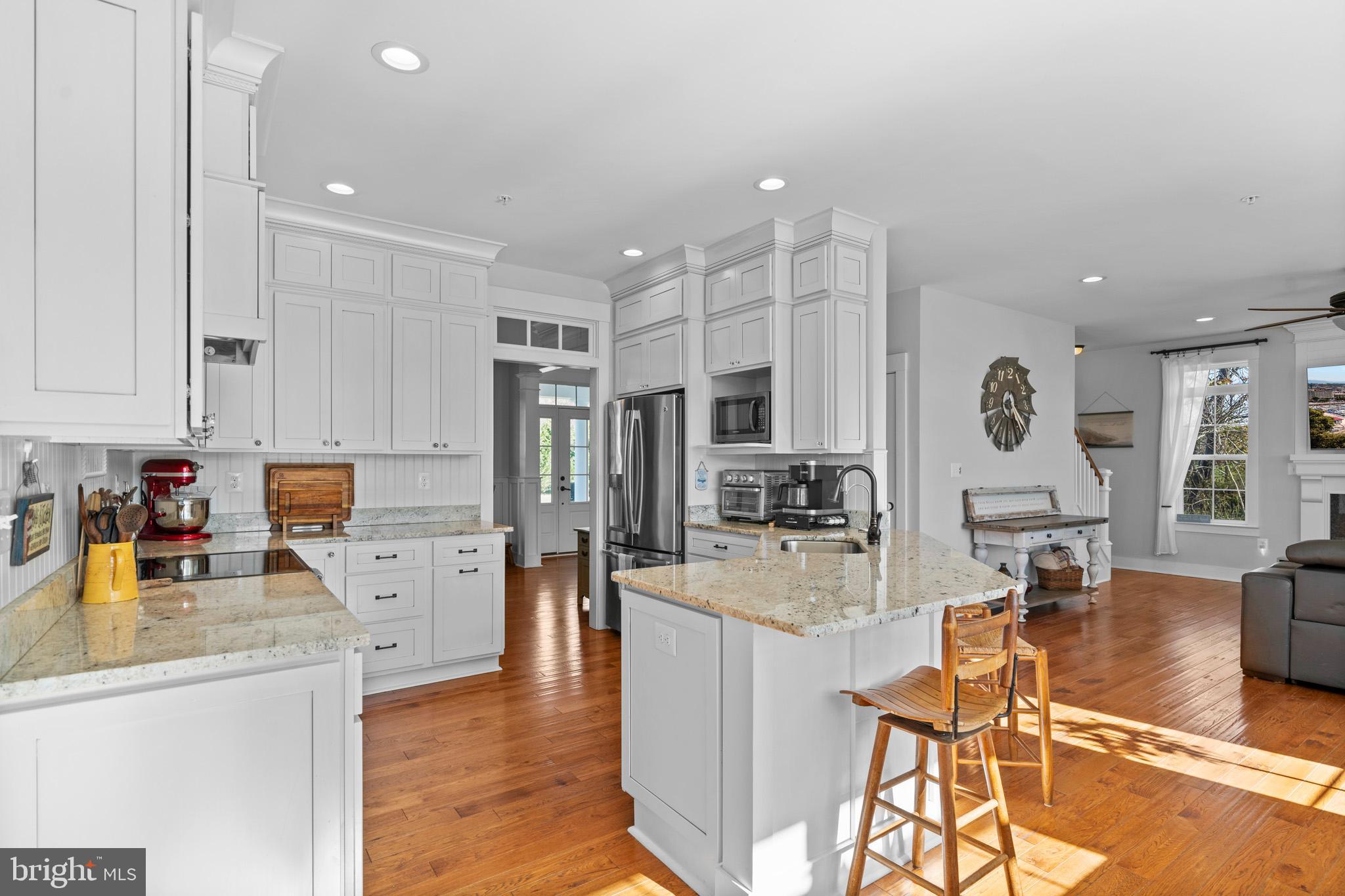 1965 Lowery Road Huntingtown, MD 20639 - Photo 17 of 54 a large kitchen with lots of counter space and living room view