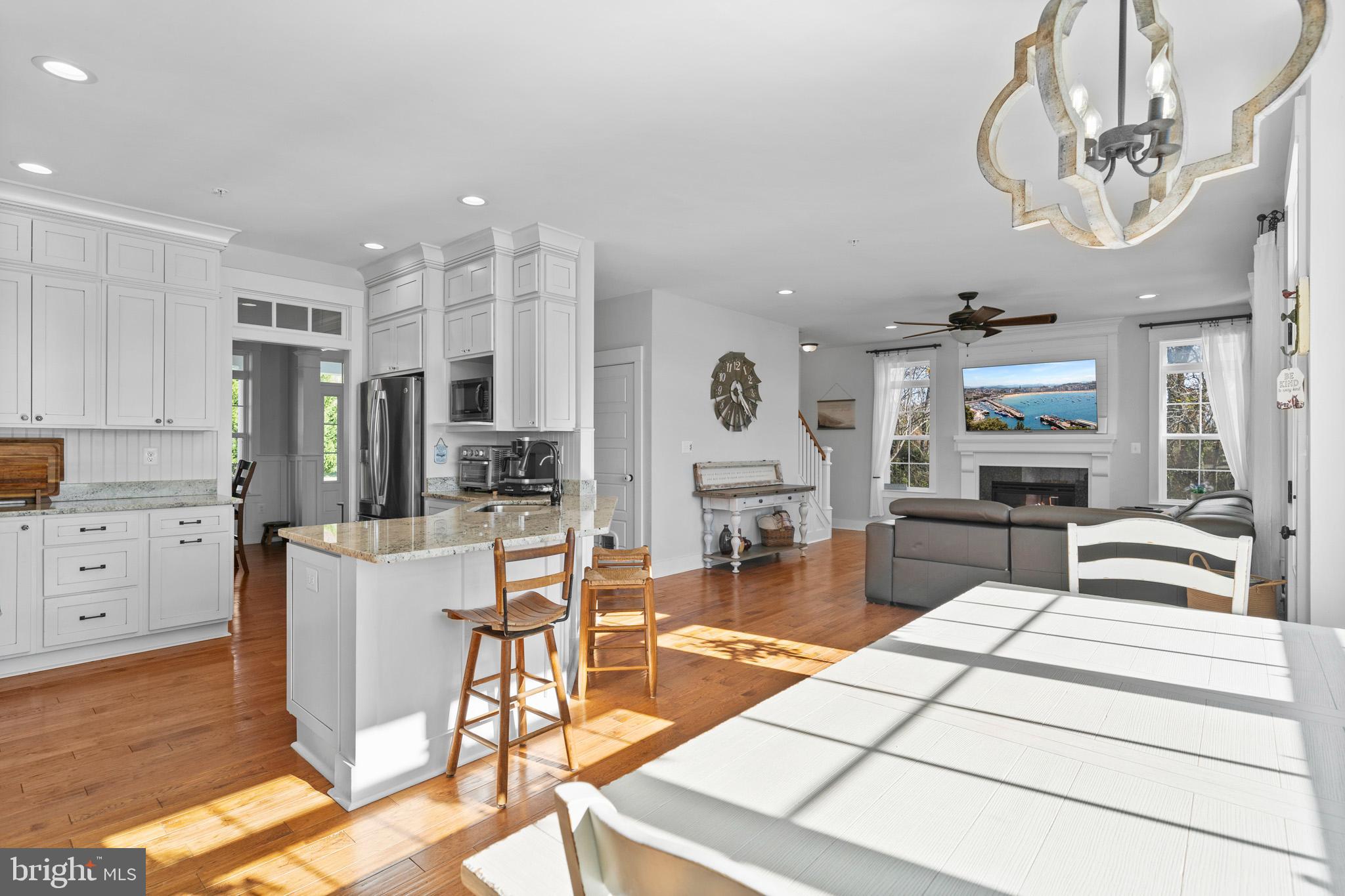 1965 Lowery Road Huntingtown, MD 20639 - Photo 20 of 54 a living room with furniture a chandelier and kitchen view