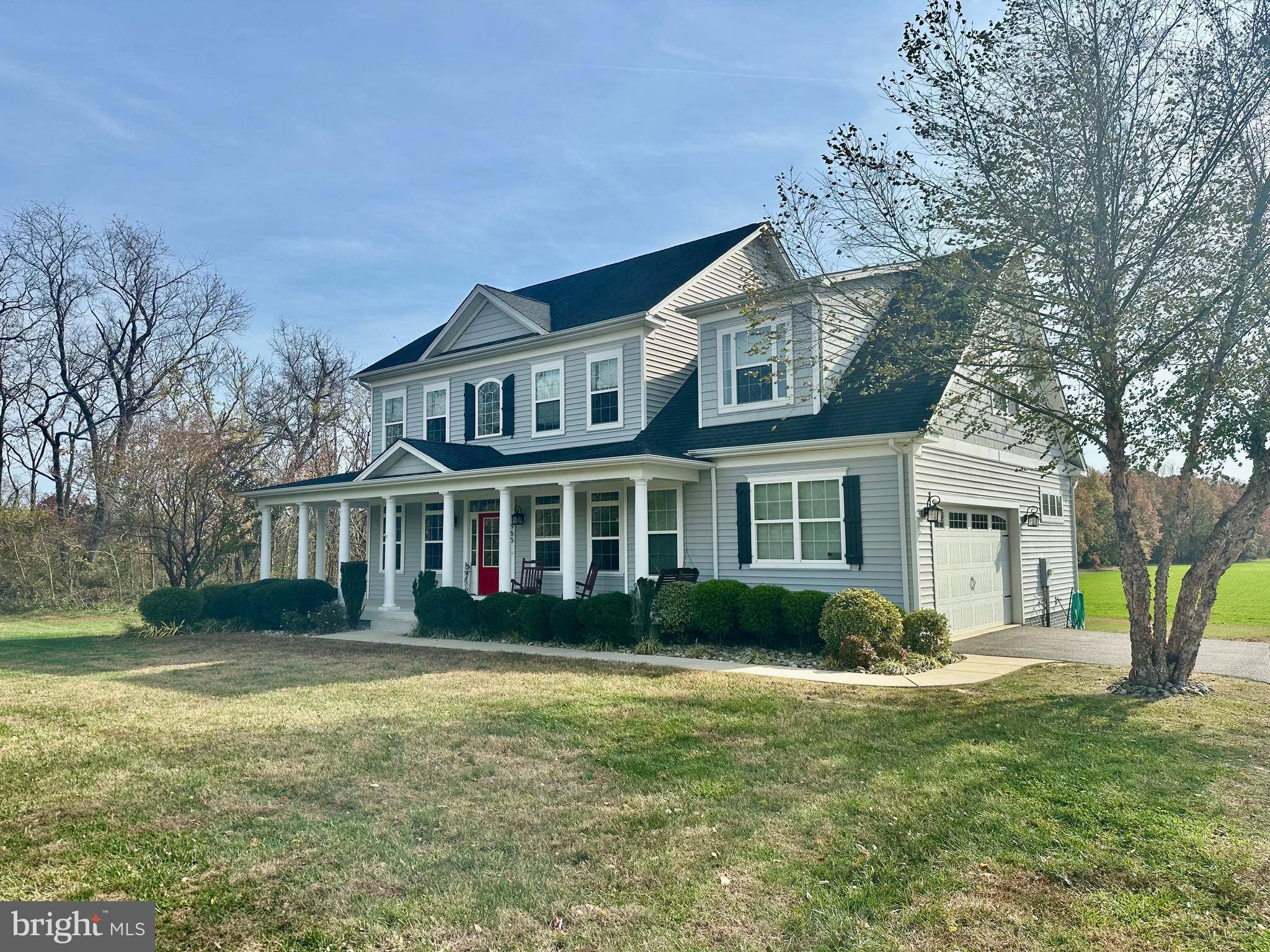 1965 Lowery Road Huntingtown, MD 20639 - Photo 2 of 54 a front view of a house with a garden