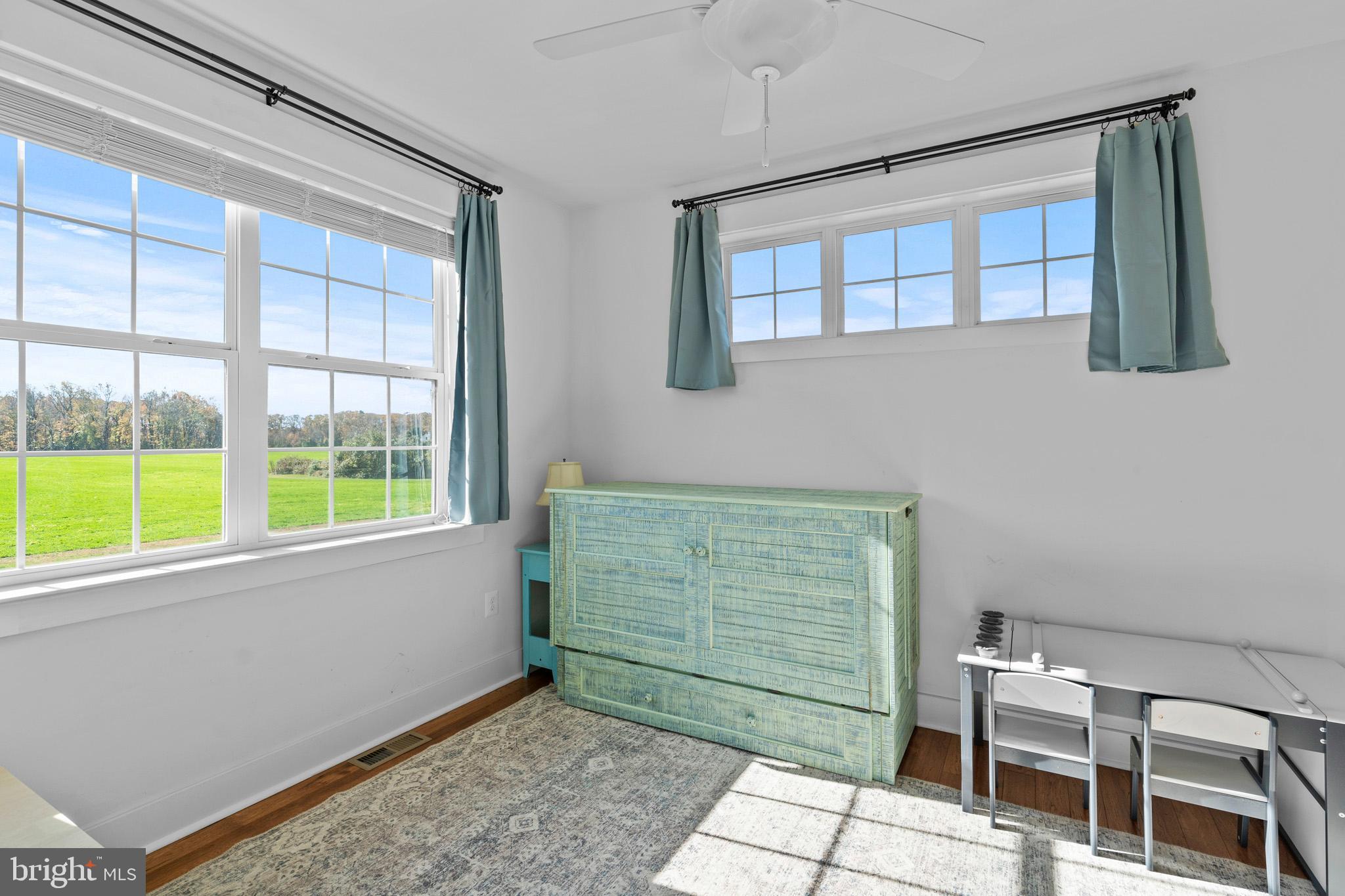 1965 Lowery Road Huntingtown, MD 20639 - Photo 24 of 54 a room that has a chair and a window in it
