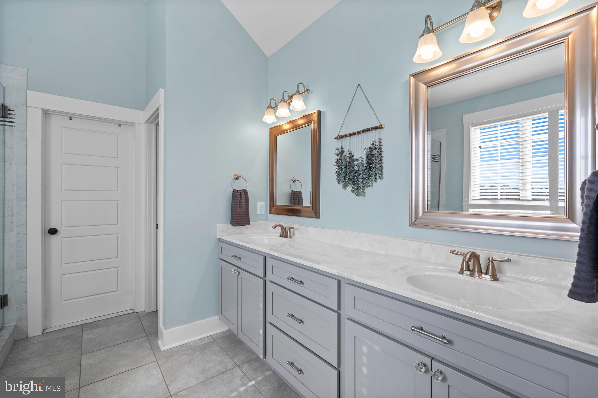 1965 Lowery Road Huntingtown, MD 20639 - Photo 30 of 54 a bathroom with a sink and a mirror
