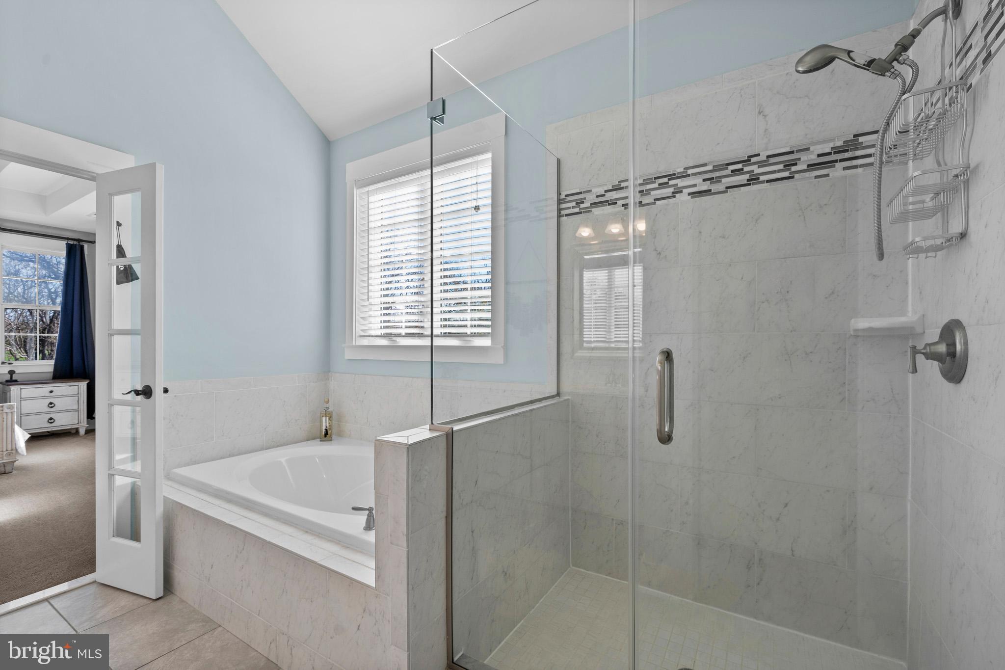 1965 Lowery Road Huntingtown, MD 20639 - Photo 33 of 54 a spacious bathroom with a granite countertop shower a fireplace and a shower