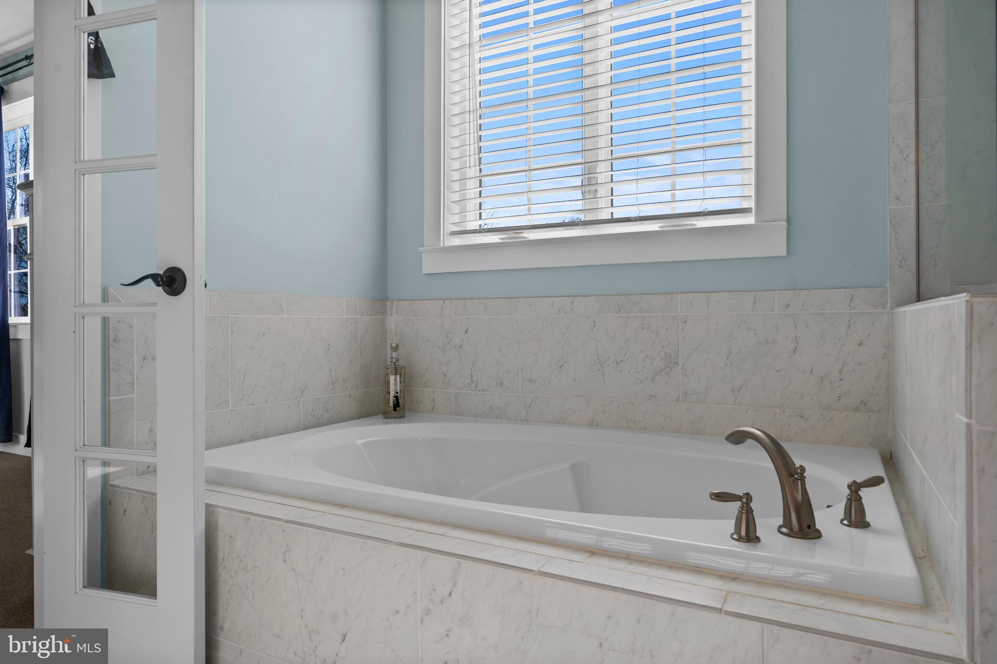 1965 Lowery Road Huntingtown, MD 20639 - Photo 35 of 54 a bathroom with bathtub and window