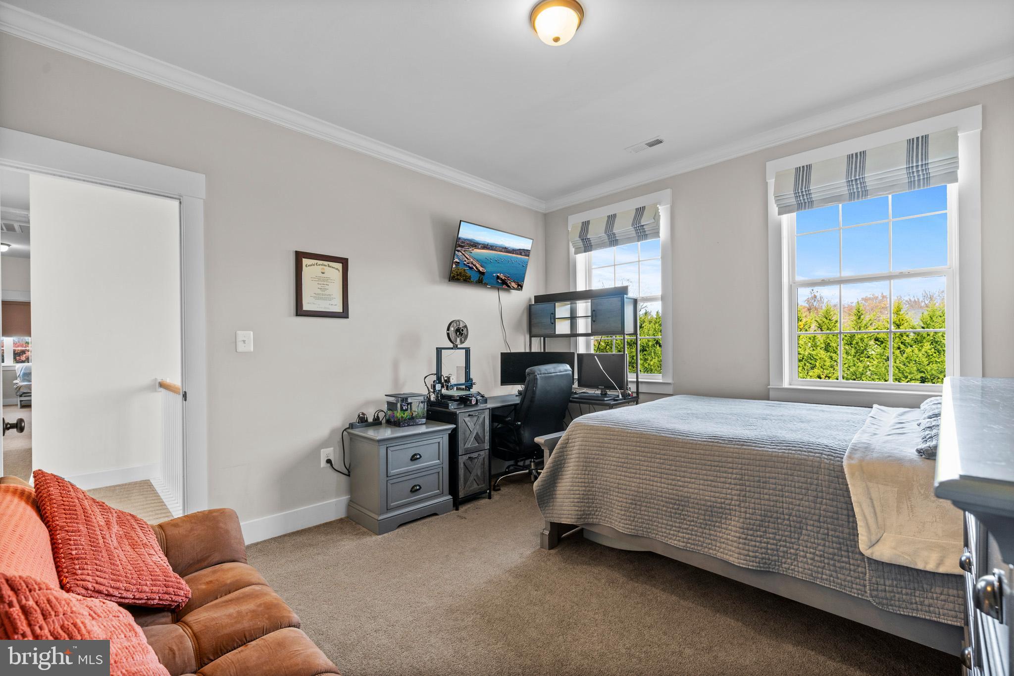 1965 Lowery Road Huntingtown, MD 20639 - Photo 38 of 54 a bedroom with a bed couch and window