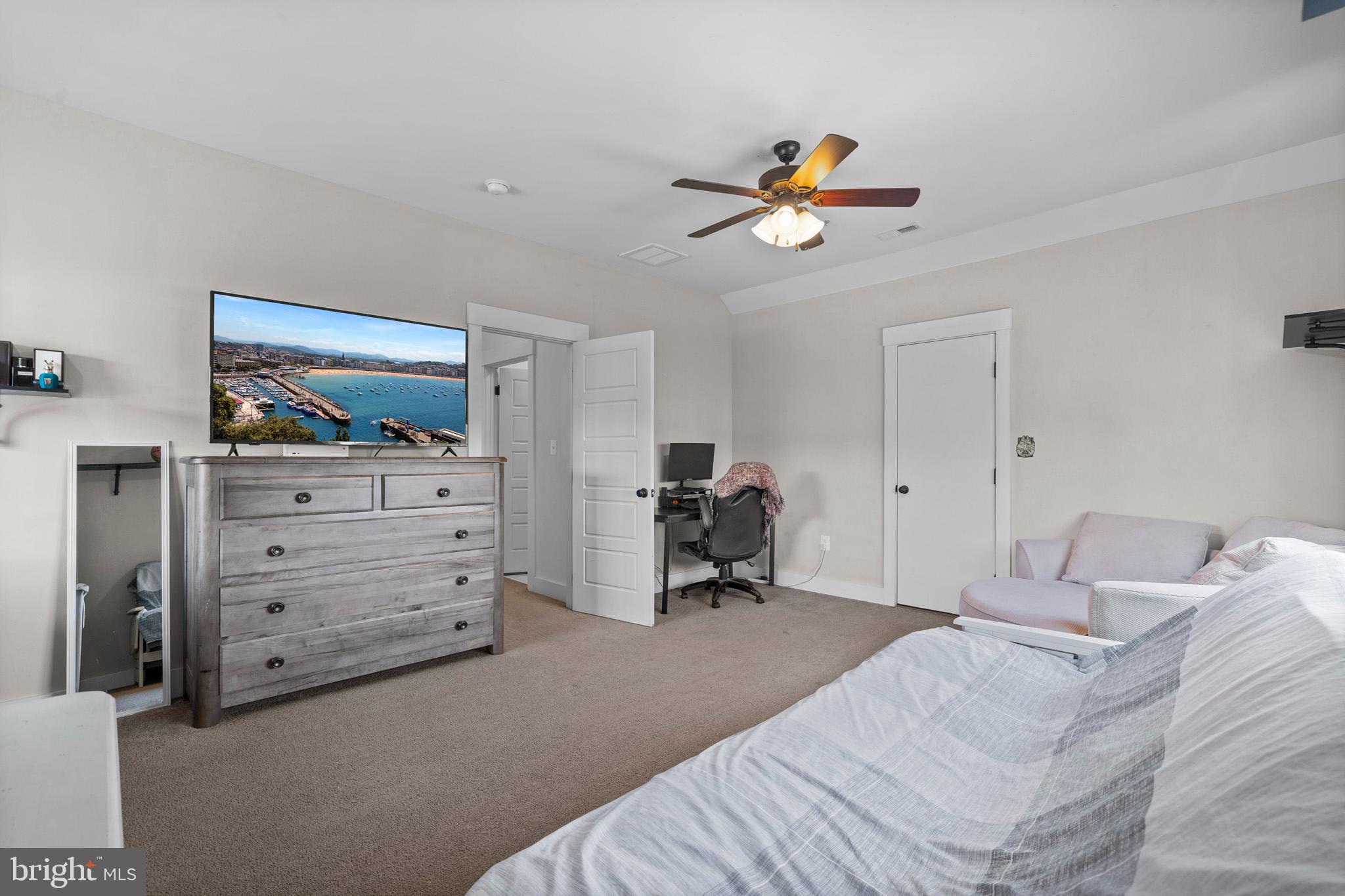 1965 Lowery Road Huntingtown, MD 20639 - Photo 42 of 54 a bedroom with a bed and a chandelier