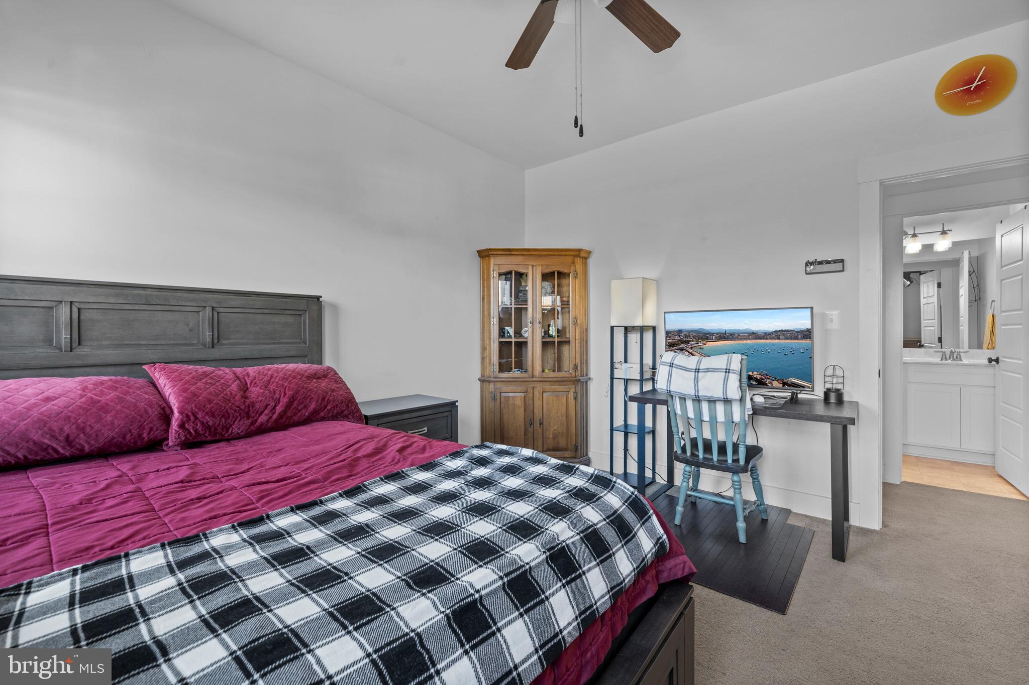 1965 Lowery Road Huntingtown, MD 20639 - Photo 45 of 54 a bedroom with a large bed and a chandelier