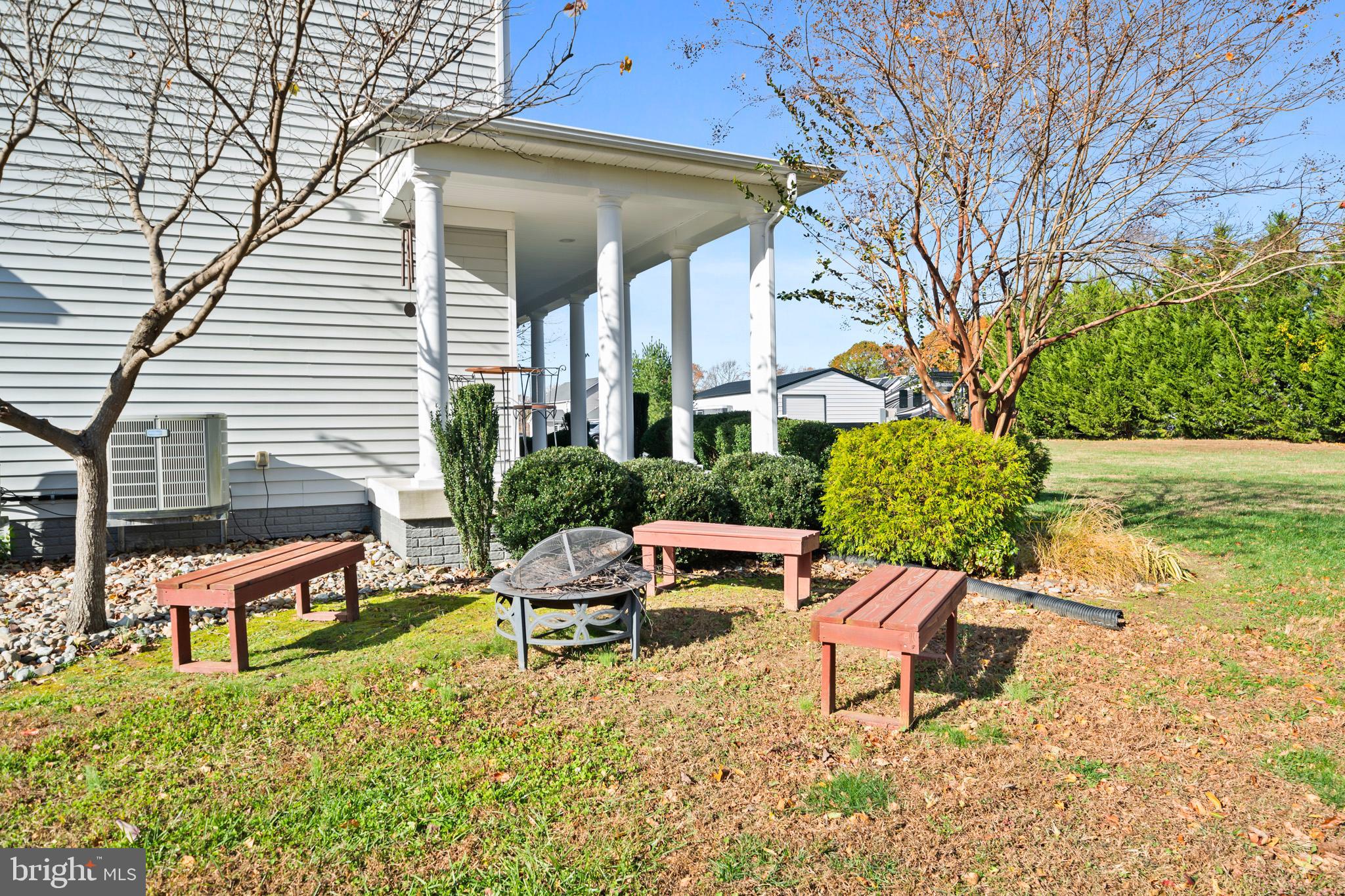 1965 Lowery Road Huntingtown, MD 20639 - Photo 48 of 54 a backyard of a house with table and chairs