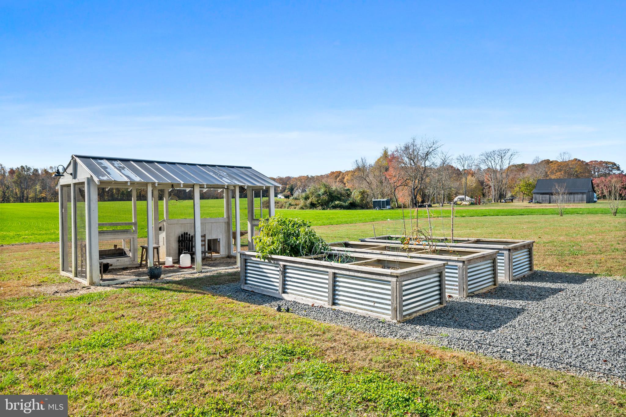 1965 Lowery Road Huntingtown, MD 20639 - Photo 51 of 54 a view of a garden with an outdoor seating