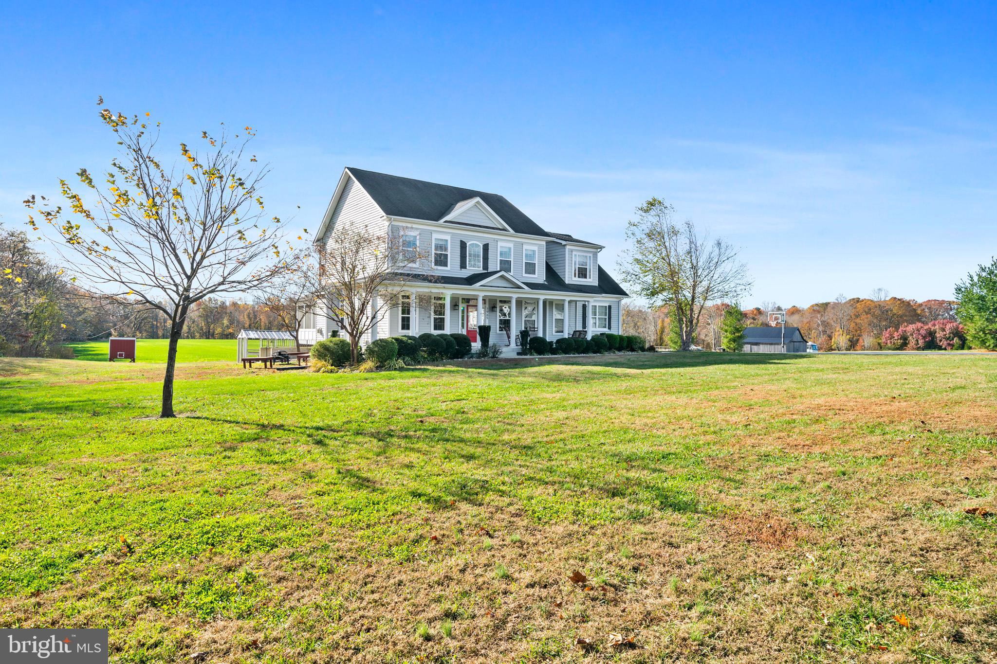 1965 Lowery Road Huntingtown, MD 20639 - Photo 54 of 54 a view of a house with a big yard and potted plants