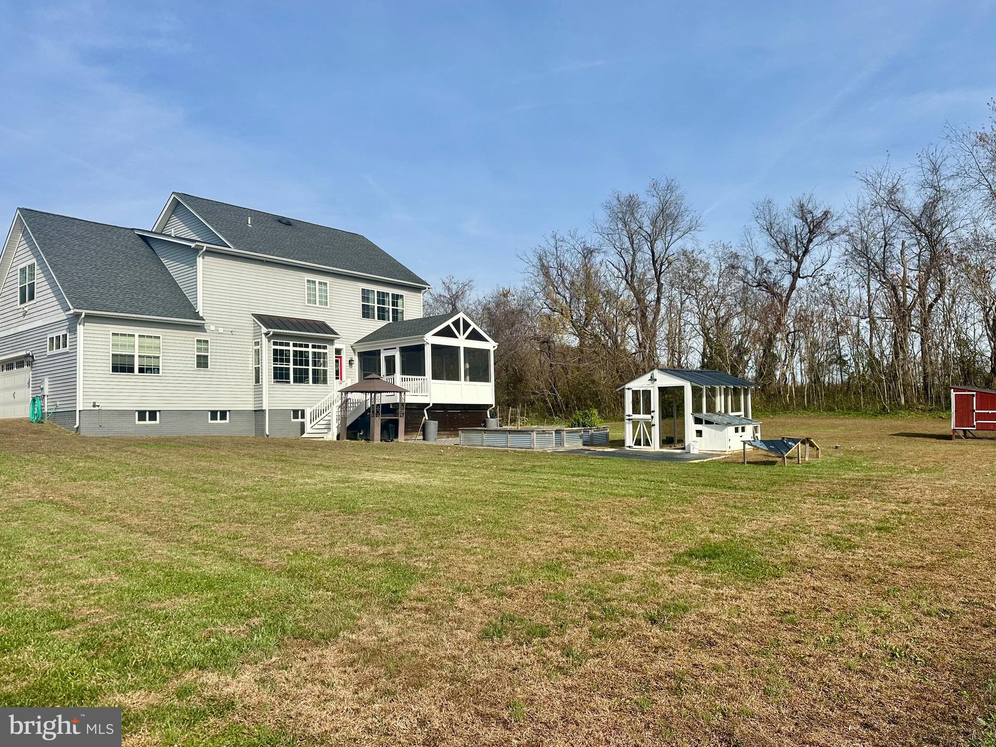 1965 Lowery Road Huntingtown, MD 20639 - Photo 7 of 54 a front view of a house with a garden