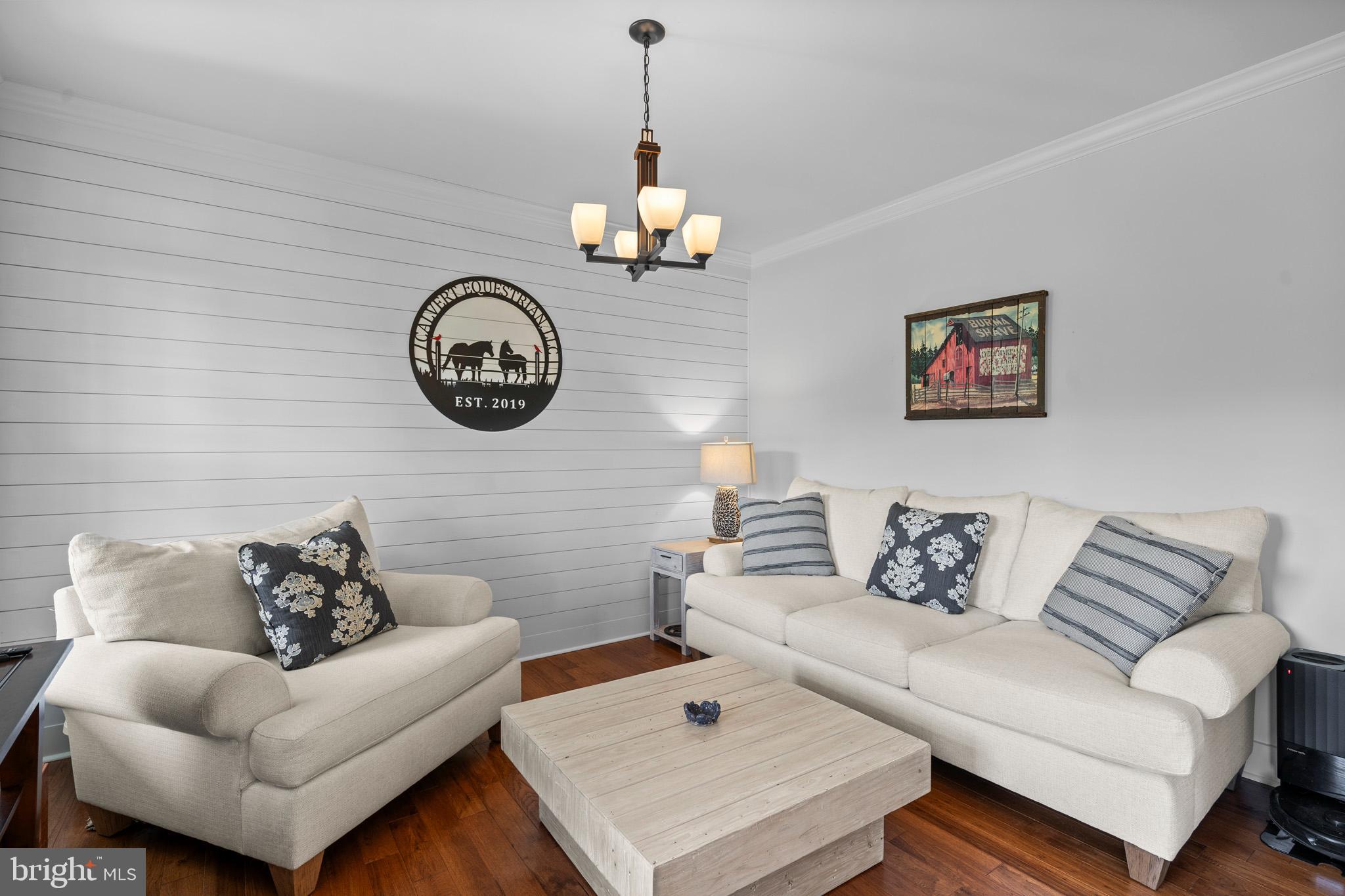 1965 Lowery Road Huntingtown, MD 20639 - Photo 9 of 54 a living room with furniture a couch and a wall painting