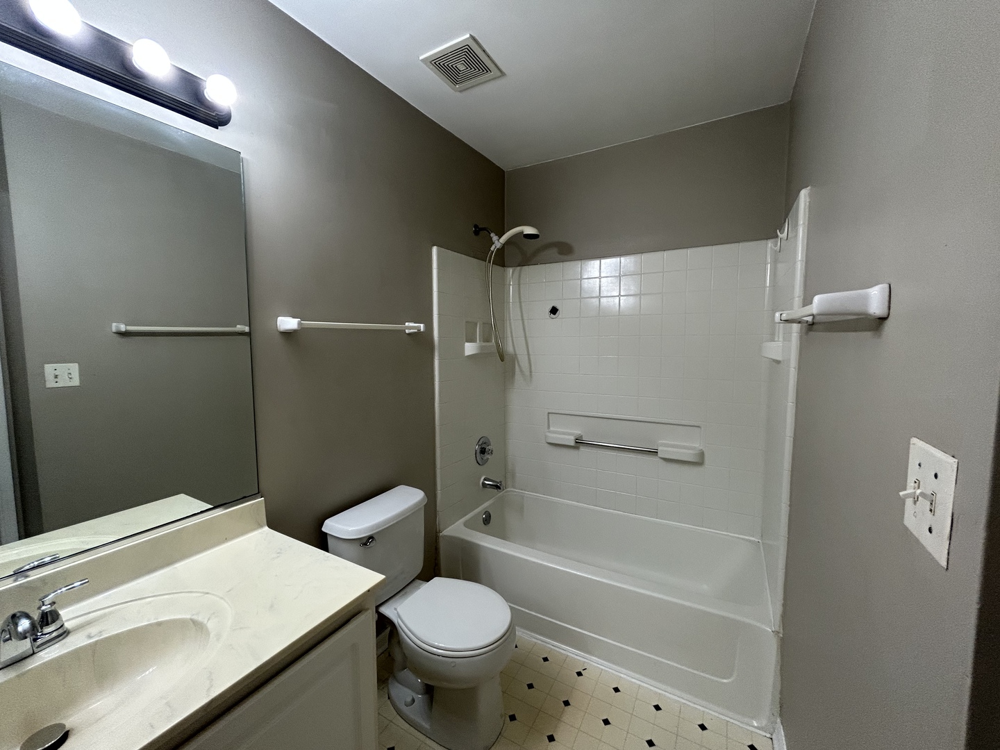 3466 Ravinia Circle, Unit 3466 Aurora, IL 60504 - Photo 12 of 24 a bathroom with a sink toilet and shower