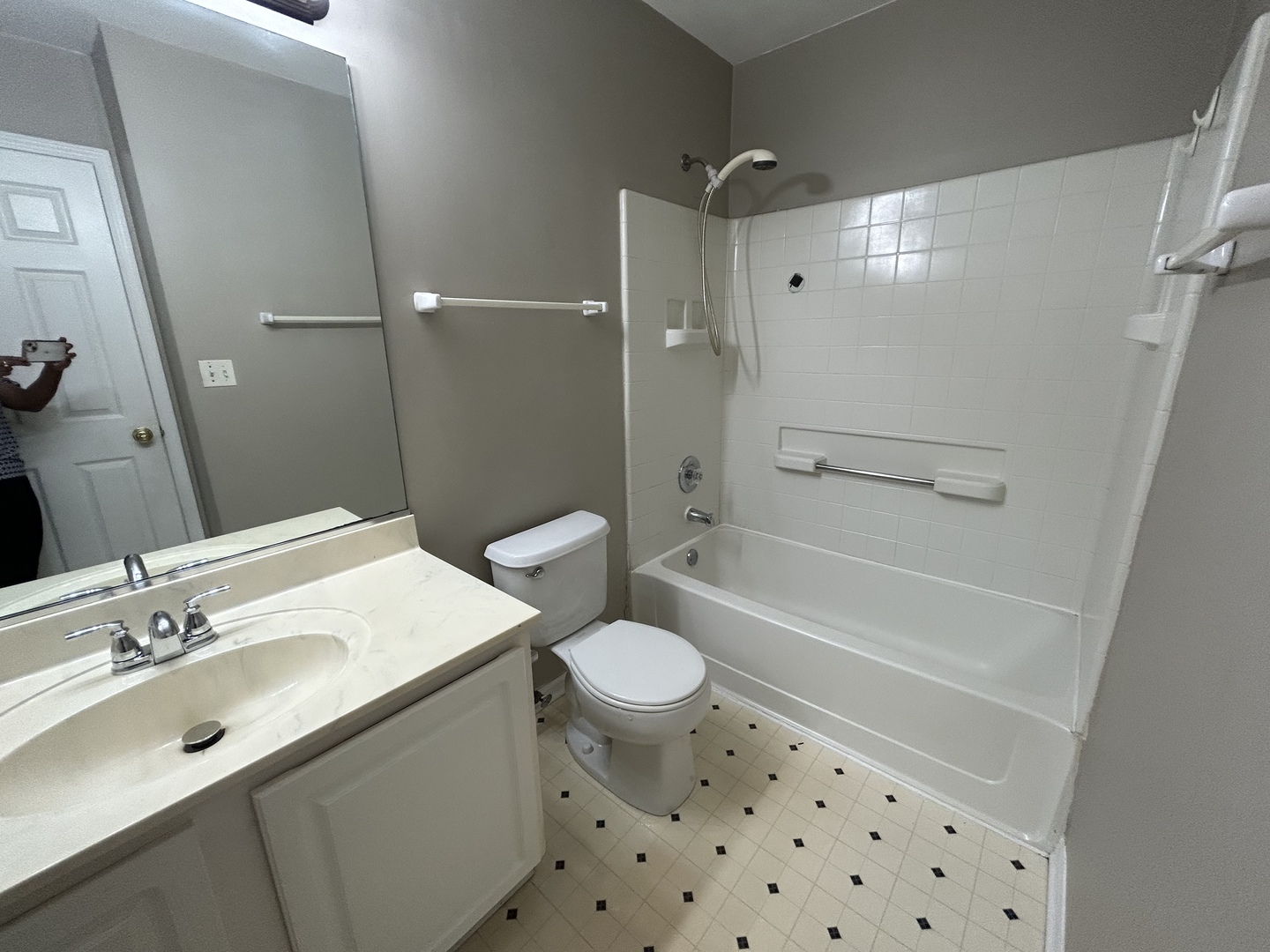 3466 Ravinia Circle, Unit 3466 Aurora, IL 60504 - Photo 18 of 24 a bathroom with a sink a toilet a mirror and shower