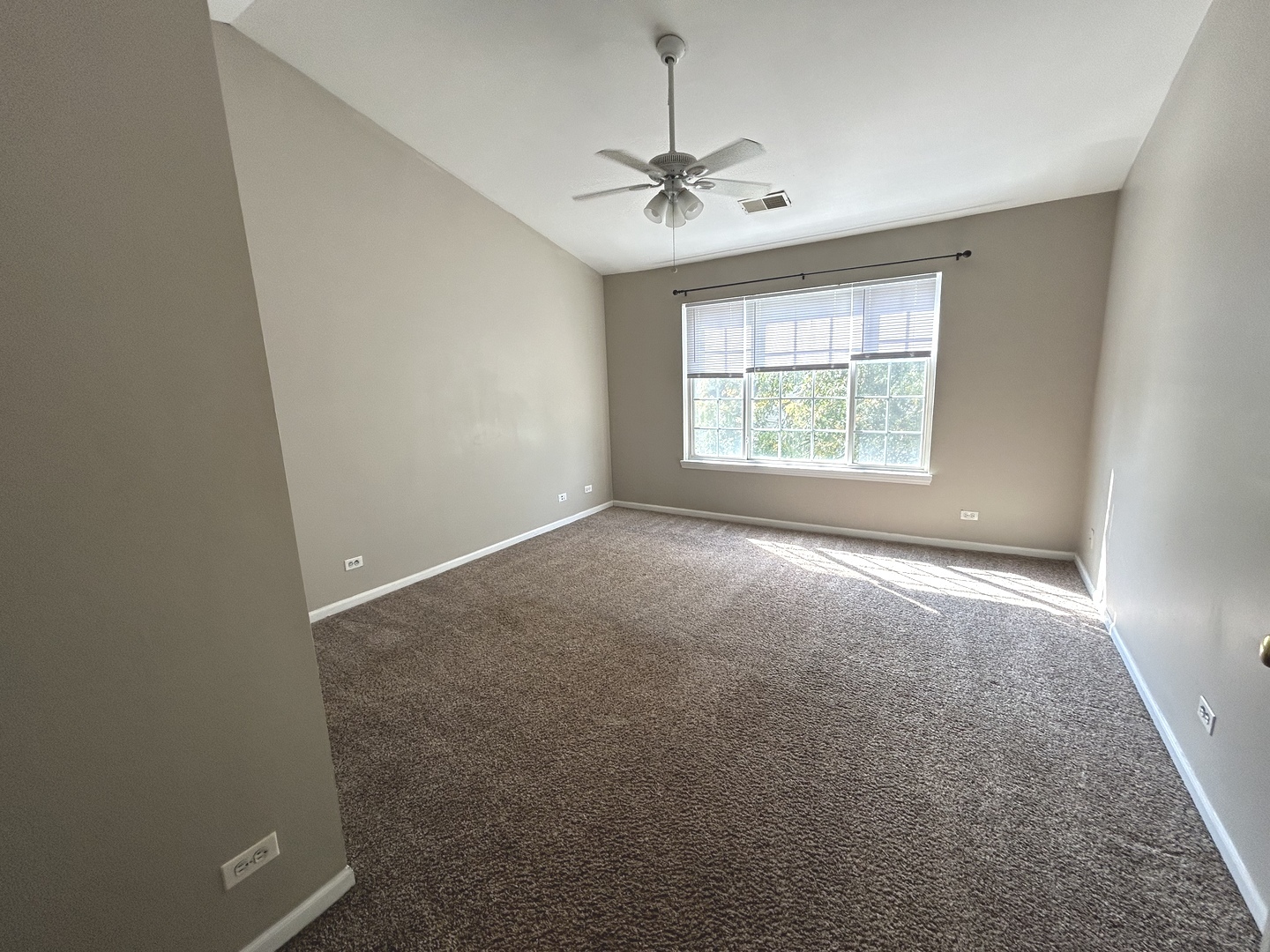 3466 Ravinia Circle, Unit 3466 Aurora, IL 60504 - Photo 21 of 24 a view of an empty room with a window