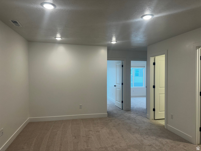 61 South Lunar Way Mapleton, UT 84664 - Photo 10 of 15 Unfurnished room featuring a textured ceiling and carpet flooring