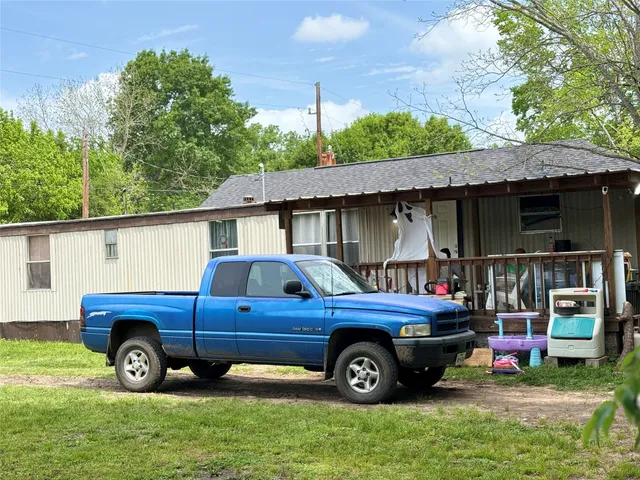 a view of a car in front of a house