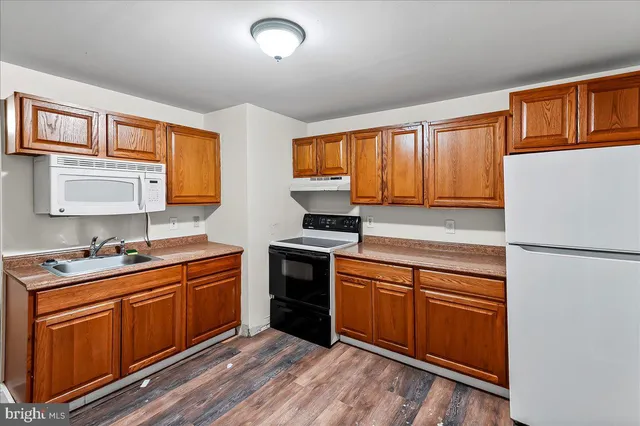 a bathroom with a shower and a sink