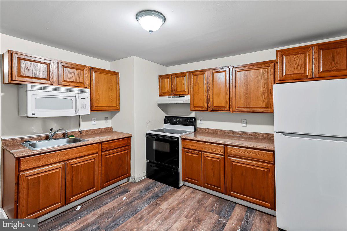 162 West Main Street Elkton, MD 21921 - Photo 22 of 41 a kitchen with stainless steel appliances granite countertop a stove a sink dishwasher and a refrigerator