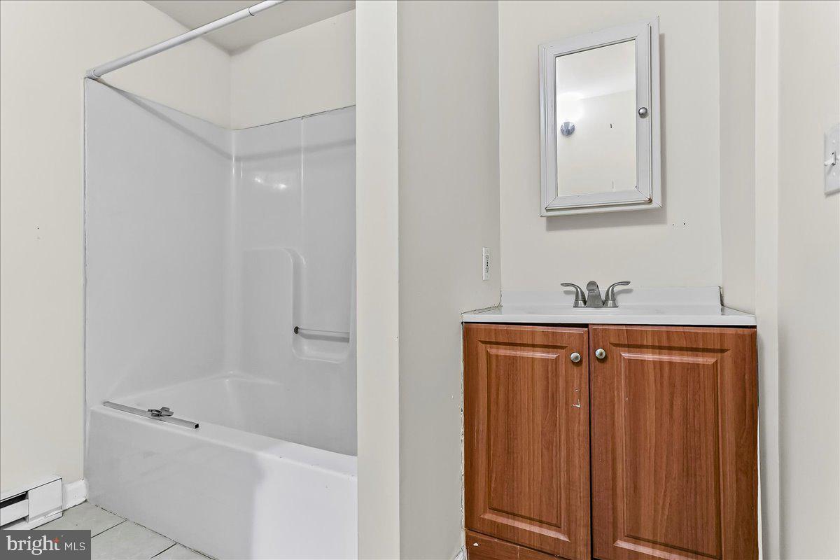 162 West Main Street Elkton, MD 21921 - Photo 23 of 41 a bathroom with a shower and a sink