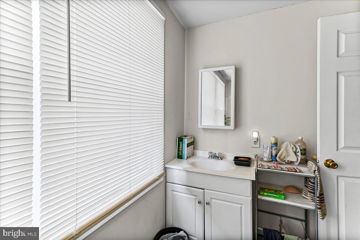 162 West Main Street Elkton, MD 21921 - Photo 32 of 41 a bathroom with a sink and a mirror