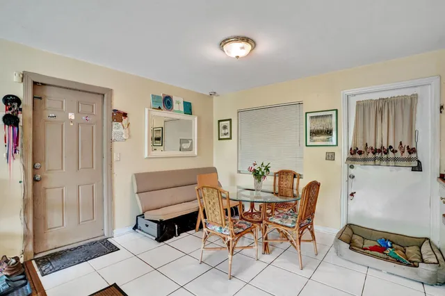 a bathroom with a sink a toilet and shower curtain