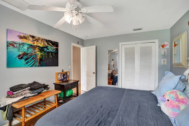 a bed room with a bed and a window