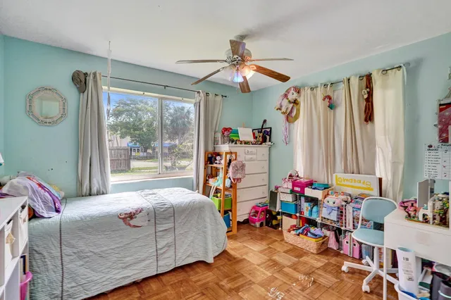 a kitchen with sink refrigerator and cabinets